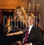 11-01-2003 Familie Paay Curry Patricia Paay and Adam Curry at home in Belgium. January 11, 2003.

[keywords]Fireplace, Posed, Candles[/keywords]